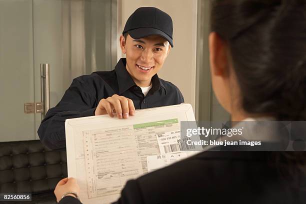 a postman delivers a letter. - business person handing over a letter fotografías e imágenes de stock