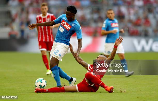 Madou Diawara of Napoloi and Arturo Vidal of Muenchen battle for the ball during the Audi Cup 2017 match between SSC Napoli and FC Bayern Muenchen at...