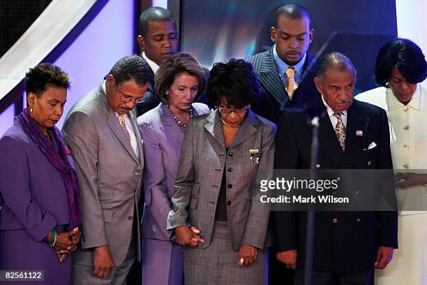 Speaker of the House Nancy Pelosi and members of the Congressional Black Caucus bow their heads during an "in memoriam" presentation on day two of...