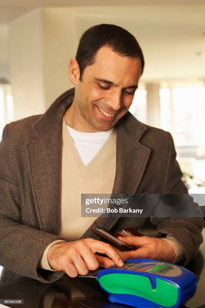 Hotel guest paying by credit card