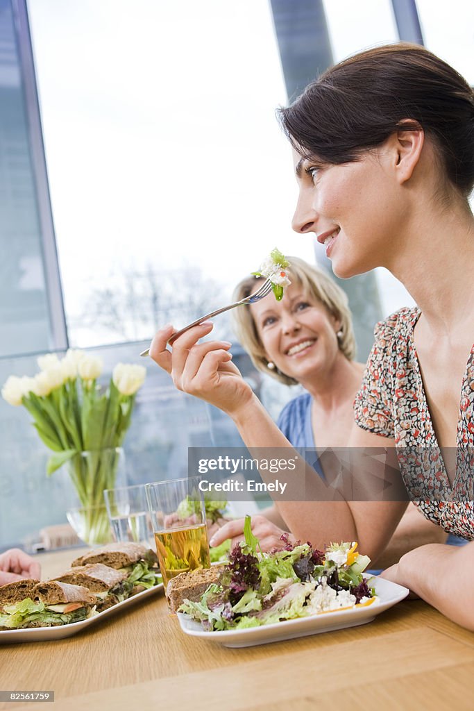 Two women eating health food