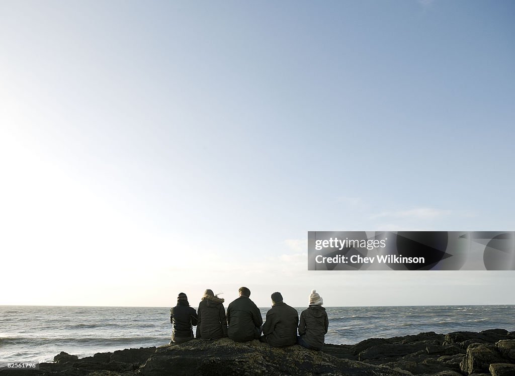 Group of Friends sitting on rock