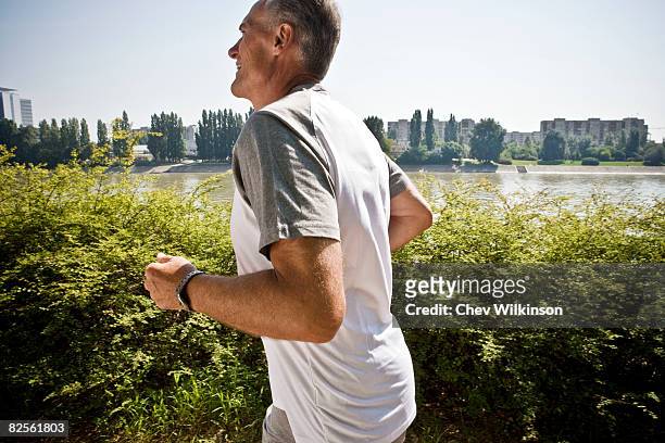 man jogging - running man profile stock pictures, royalty-free photos & images