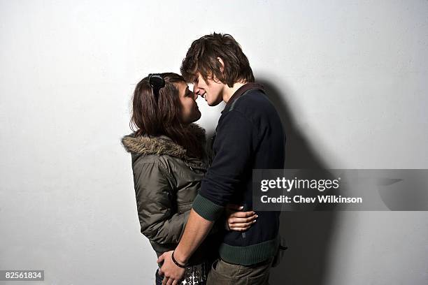 young couple embracing low view - young love stock pictures, royalty-free photos & images