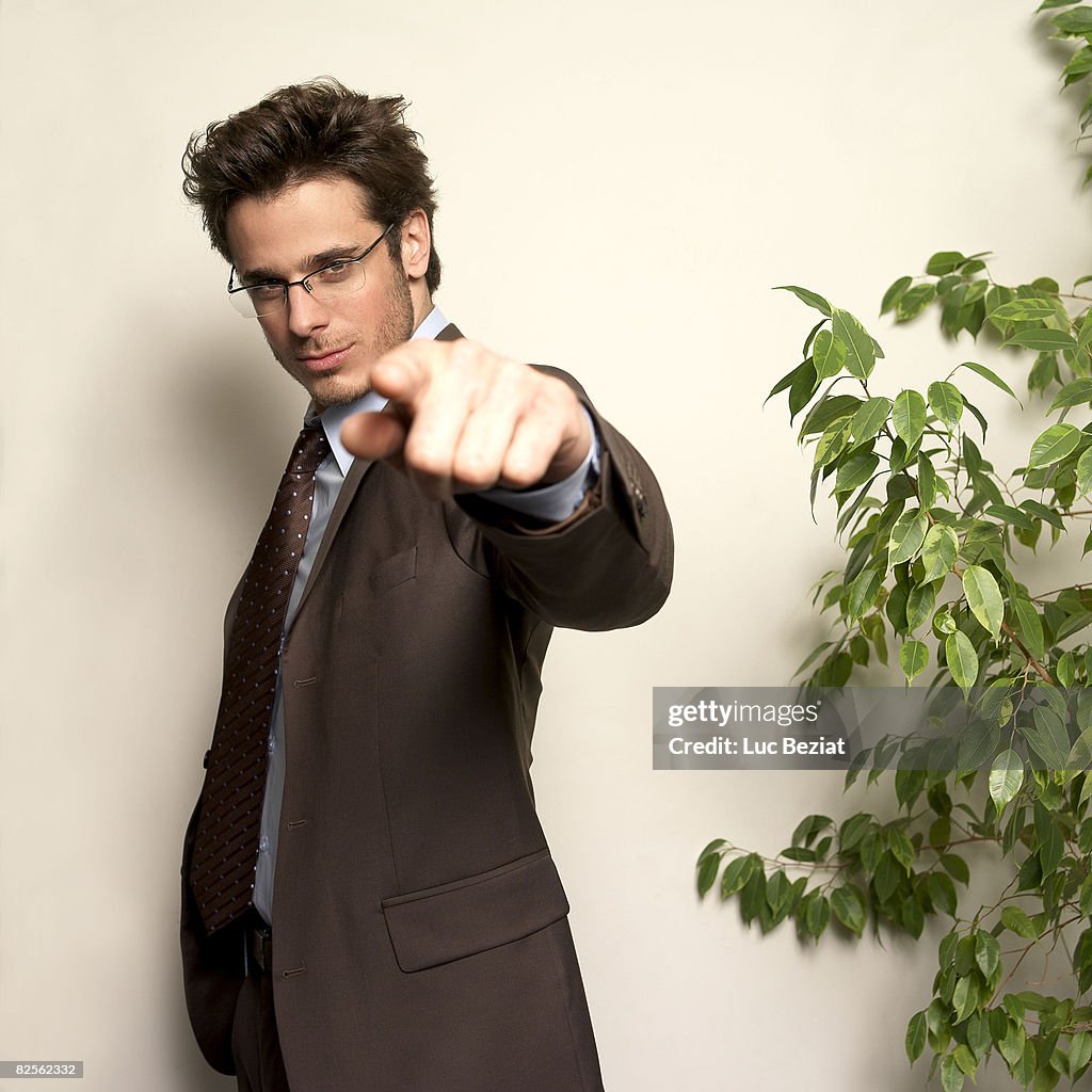 Man in office looking at camera