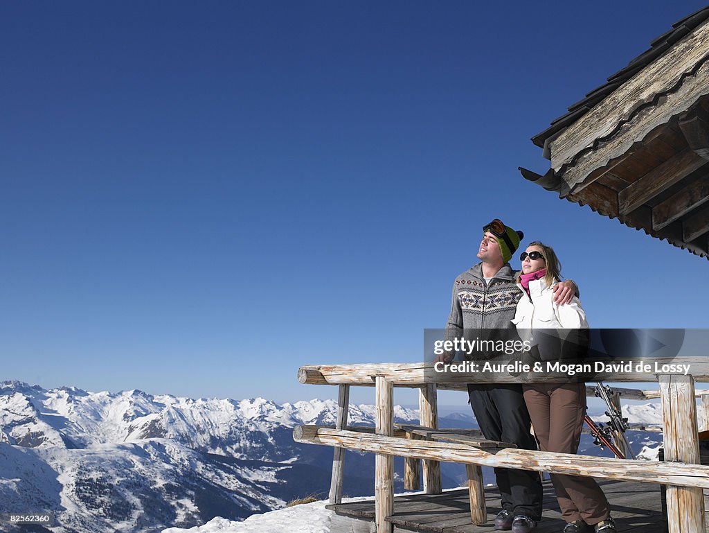 Couple enjoying sun at mountains
