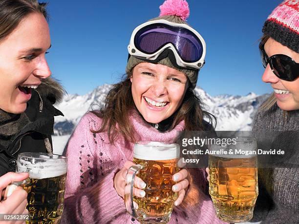 young women having drink at mountains - beer goggles stock pictures, royalty-free photos & images