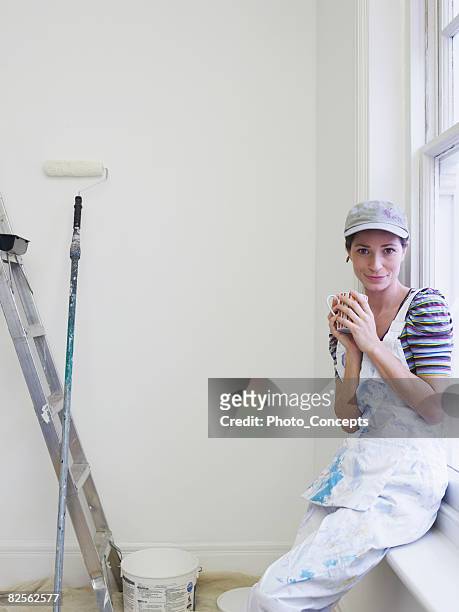 portrait of female decorator - protective sheet stock pictures, royalty-free photos & images