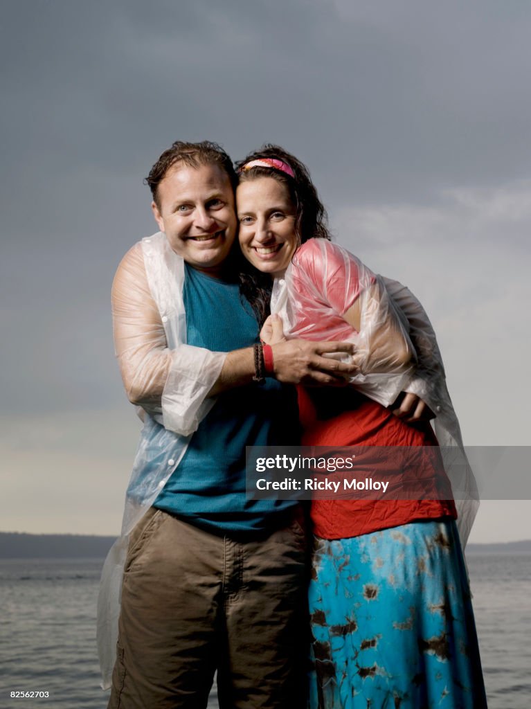 Man and woman standing in the rain
