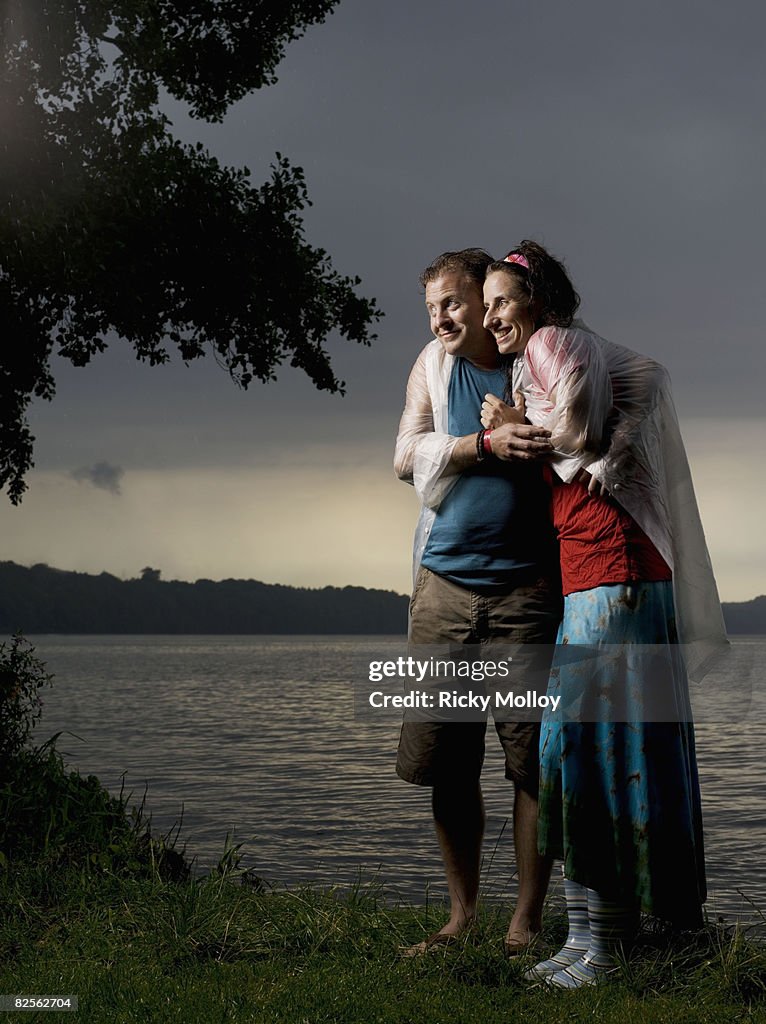 Man and woman standing in the rain