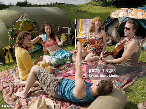 five people on blankets in tent camp - the comedy tent stock pictures, royalty-free photos & images