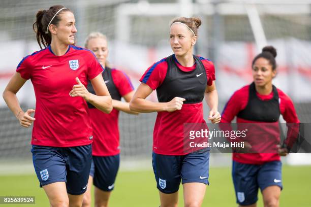 Jill Scott and Casey Stoney run during the England Training Session at Sporting 70 on August 2, 2017 in Utrecht, Netherlands.