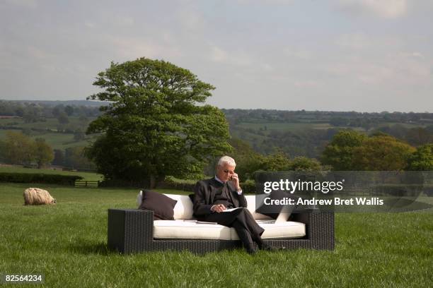 businessman on mobile phone  - bizarre landscape stock pictures, royalty-free photos & images