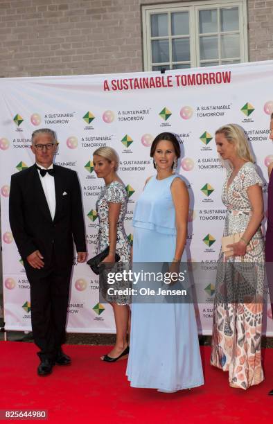 Princess Sofia of Sweden show her baby belly when she pose together with Bo Nilsson and spouses to the charity party in support of 'A Sustainable...