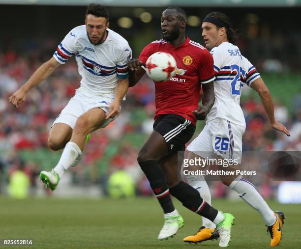 Romelu Lukaku of Manchester United in action with Vasco Regini and Matias Silvestre of Sampdoria during the International Champions Cup pre-season...