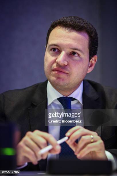 Rafael Menin, chief executive officer of MRV Engenharia e Participacoes SA, listens during an interview in New York, U.S., on Wednesday, Aug. 2,...