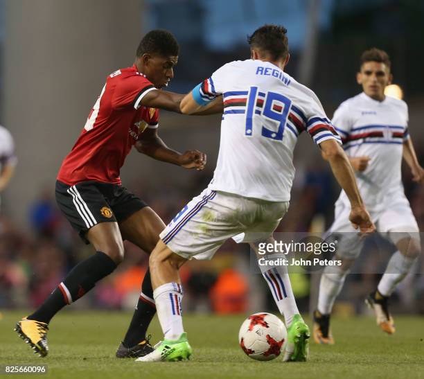 Marcus Rashford of Manchester United in action with Vasco Regini of Sampdoria during the International Champions Cup pre-season friendly match...