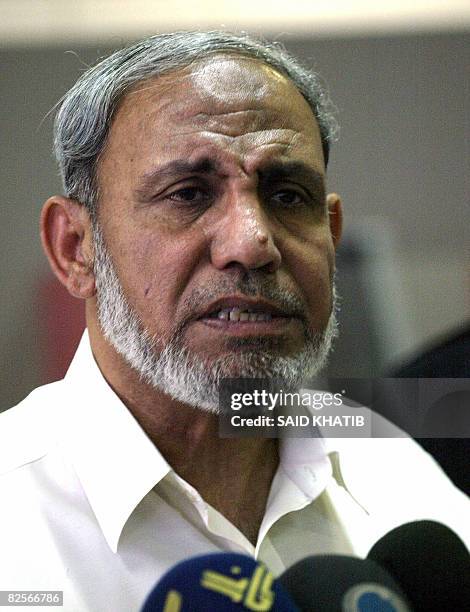 Palestinian senior Hamas official Mahmud Zahar speaks to the press at the Rafah border terminal crossing between the southern Gaza Strip and Egypt on...