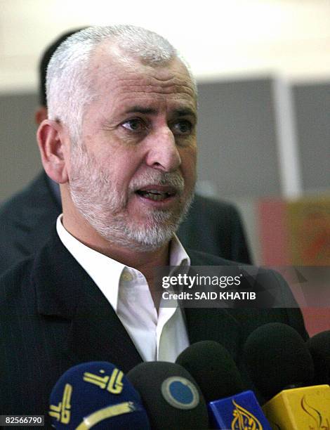 Palestinian former interior minister Said Siam speaks to the press at the Rafah border terminal crossing between the southern Gaza Strip and Egypt on...