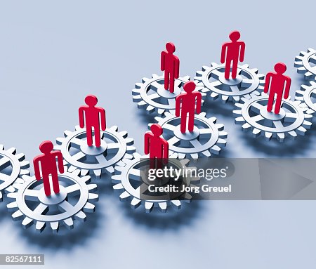 Stick figures on cogwheels Stick figures on cogwheels