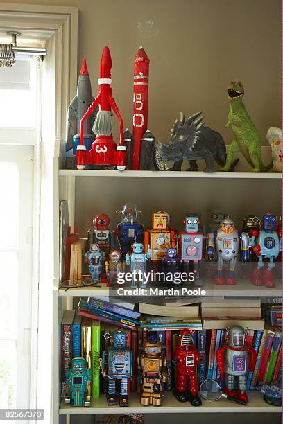 toys on shelf in childs bedroom - display stockfoto's en -beelden