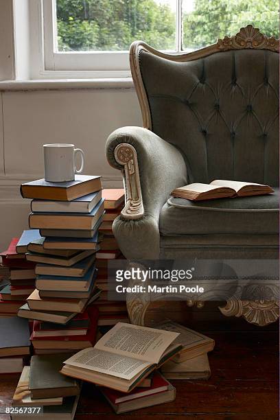 mug and pile of books  - stack of books stock pictures, royalty-free photos & images