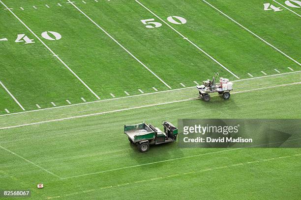 american football field being prepared for game. - 50ヤードライン ストックフォトと画像
