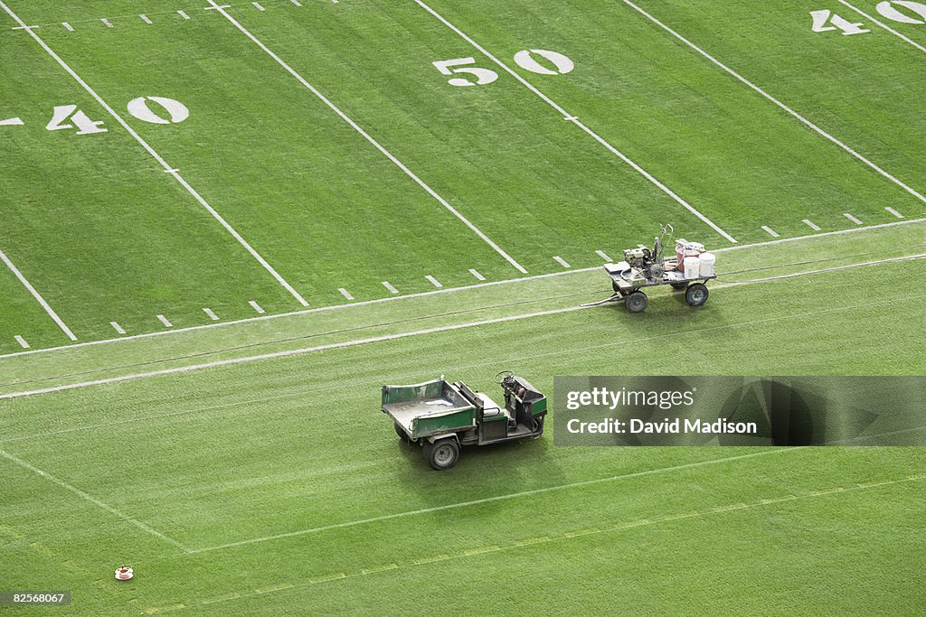 American football field being prepared for game.