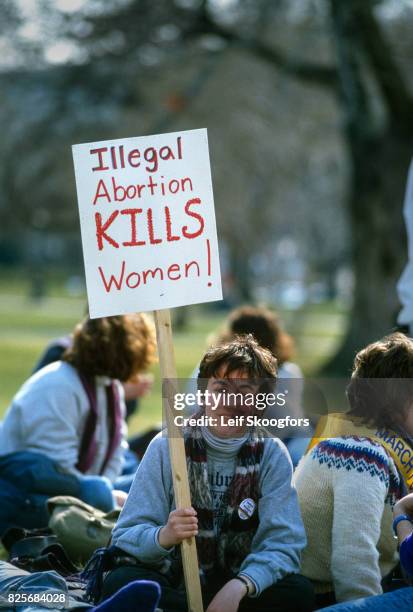 Portrait of an unidentified, pro-choice demonstrator as she holds a sign during the March For Women's Lives, Washington DC, April 25, 2004. Her sign...