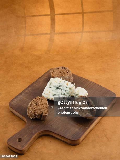 roquefort piece and cut baguette. - blue cheese crumble stock pictures, royalty-free photos & images
