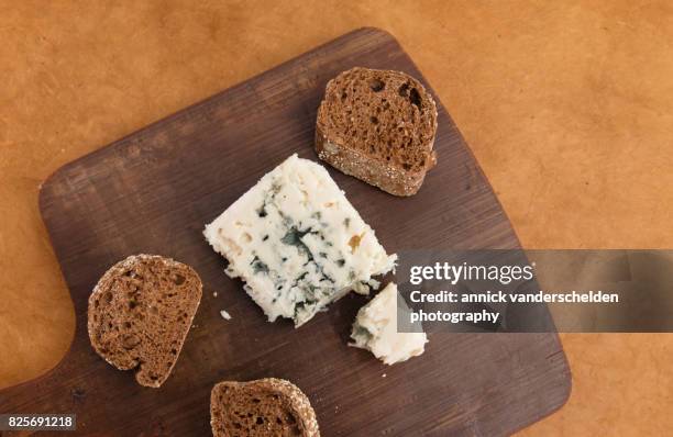 roquefort piece and cut baguette. - roquefort stock pictures, royalty-free photos & images