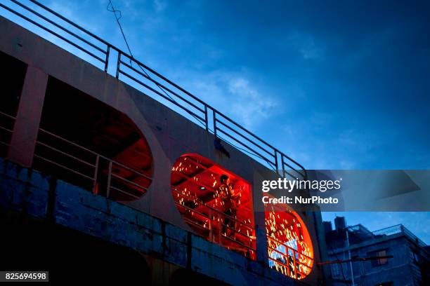 Labour works in a dockyard evening time in the side of Buriganga River at Dhaka August 2, 2017. The laborers work in the dockyard without proper...