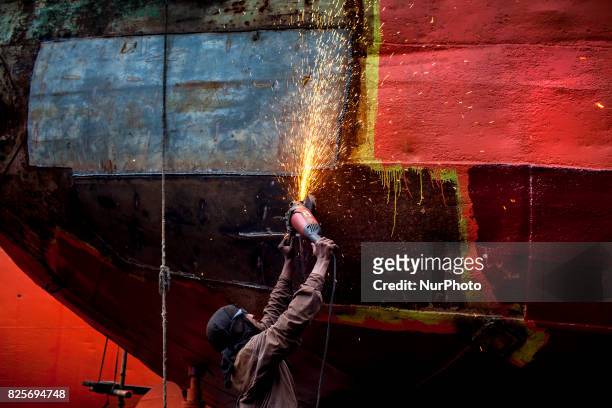 Labour weldingt ship in a dockyard in the side of Buriganga River at Dhaka August 2, 2017. The laborers work in the dockyard without proper safety...