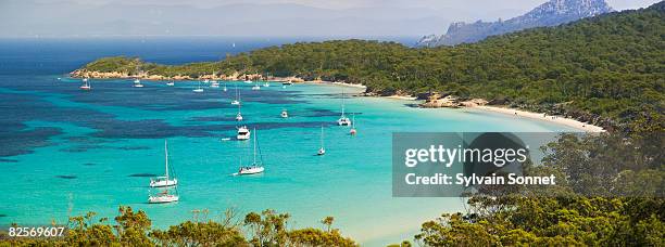 france, provence, island of porquerolles - blue sailboat stock pictures, royalty-free photos & images