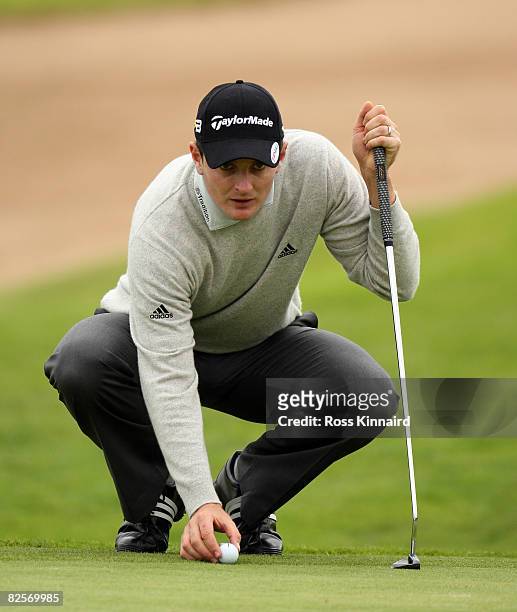 Justin Rose of England places his ball during the pro-am event prior to The Johnnie Walker Championship at Gleneagles on August 27, 2008 at the...