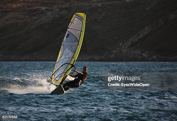 Windsurfer glides with his board in Prasonissi, on July 20, 2008 in Rhodes, Greece. Rhodes is the largest of the greek Dodecanes Islands.