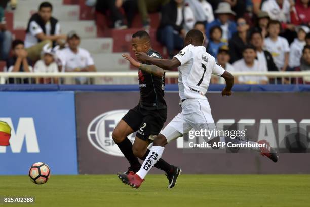 Bolivia's Bolivar Edemir Rodriguez vies for the ball with Ecuador's Liga de Quito Anibal Chala during their 2017 Copa Sudamericana football match at...