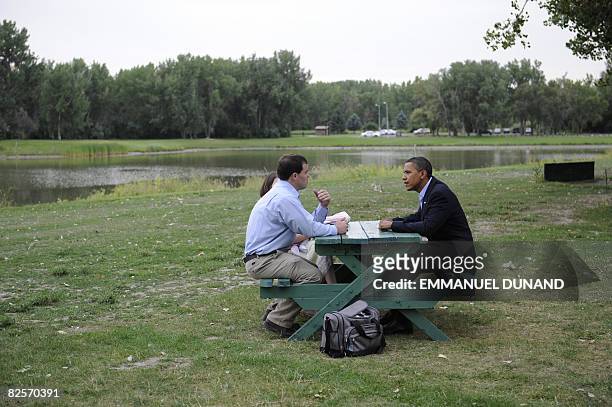 Democratic presidential candidate Senator Barack Obama meets with Montana residents Matt Kunz his wife Sandy and infant daughter Fiona before a...