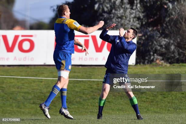 Dominic Bird and Ben Smith warm up during a New Zealand All Blacks training session on August 3, 2017 in Christchurch, New Zealand.