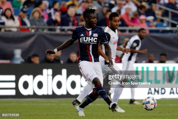 New England Revolution midfielder Gershon Koffie plays a through ball during an MLS match between the New England Revolution and the Philadelphia...