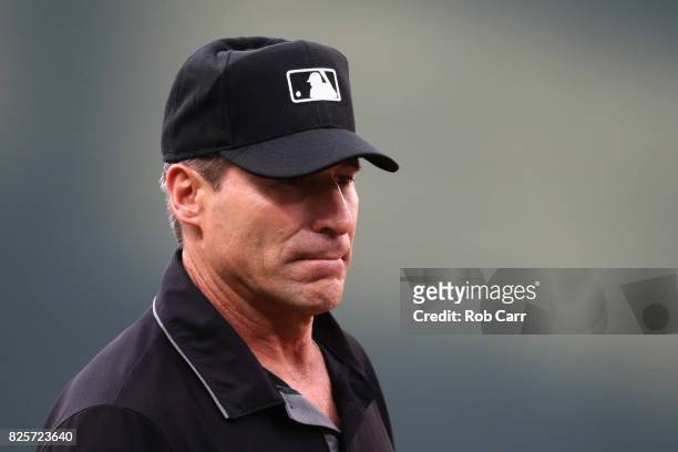 Third base umpire Angel Hernandez looks on in the first inning of the Baltimore Orioles and Kansas City Royals game at Oriole Park at Camden Yards on...