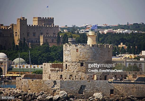 Mandraki Harbour with the old town and the Palace of the Grand Masters and the tower Agios Nikolaos is seen on July 20, 2008 in Rhodes, Greece....