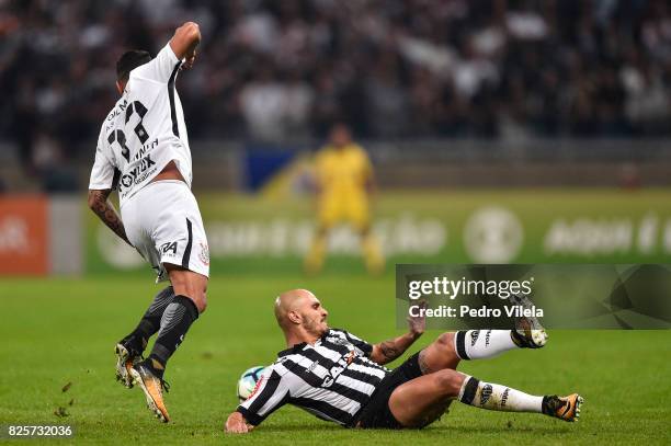 Fabio Santos of Atletico MG and Giovanni Augusto of Corinthians battle for the ball during a match between Atletico MG and Corinthians as part of...