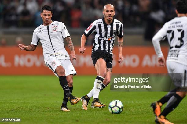 Fabio Santos of Atletico MG and Giovanni Augusto of Corinthians battle for the ball during a match between Atletico MG and Corinthians as part of...