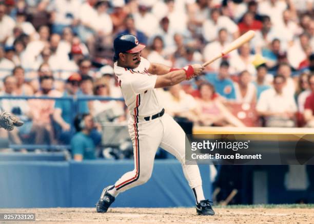 Carlos Baerga of the Cleveland Indians swings an the pitch during an MLB game circa 1990 at Cleveland Stadium in Cleveland, Ohio.