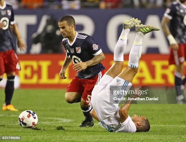 Sebastian Giovinco of the MLS All-Stars moves around Lucas Vazquez of Real Mardrid during the 2017 MLS All- Star Game at Soldier Field on August 2,...