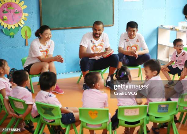 Player Tony Parker has class with kids at a rehabilitation center for disabled children on August 2, 2017 in Guilin, Guangxi Zhuang Autonomous Region...