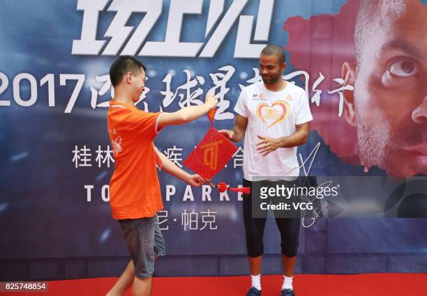 Player Tony Parker visits a rehabilitation center for disabled children on August 2, 2017 in Guilin, Guangxi Zhuang Autonomous Region of China.
