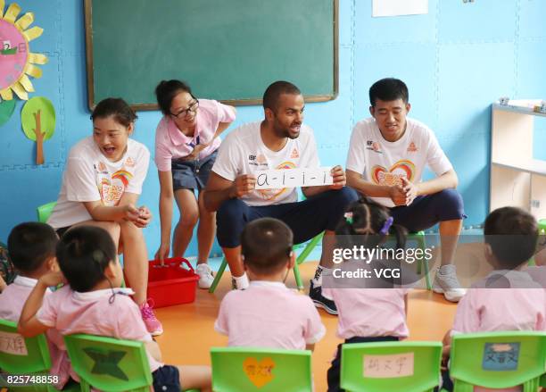 Player Tony Parker has class with kids at a rehabilitation center for disabled children on August 2, 2017 in Guilin, Guangxi Zhuang Autonomous Region...