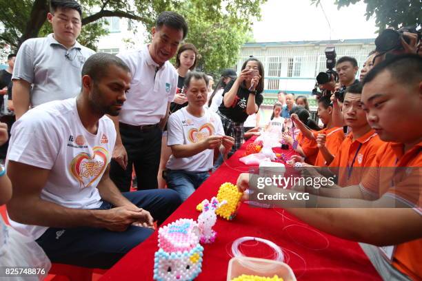 Player Tony Parker visits a rehabilitation center for disabled children on August 2, 2017 in Guilin, Guangxi Zhuang Autonomous Region of China.